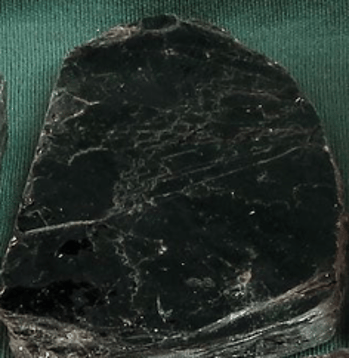 <p>Mafic Mineral (dark in color and high density) <br>high concentrations of some combination of iron, magnesium, calcium, and titanium. They tend to have low concentrations of silica, sodium, aluminum, and potassium</p>