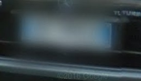 <p>This country has blue on left and right sides of license plate. The antenna should be viewable. Cars may also have red on left side of plate</p>