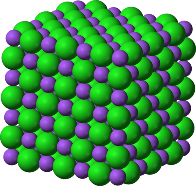 <p>a three-dimensional structure of oppositely charged ions, bonded together by strong ionic bonds</p>