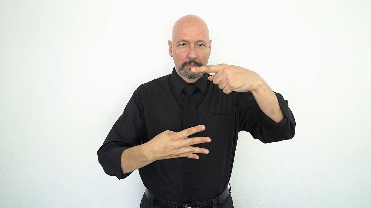 <p>Sign a “click” and then move four fingers (on the left hand) down to indicate a dropdown menu</p>