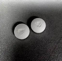 <p>tablet material adhering to dye wall </p><p>sticks to other tabs </p>