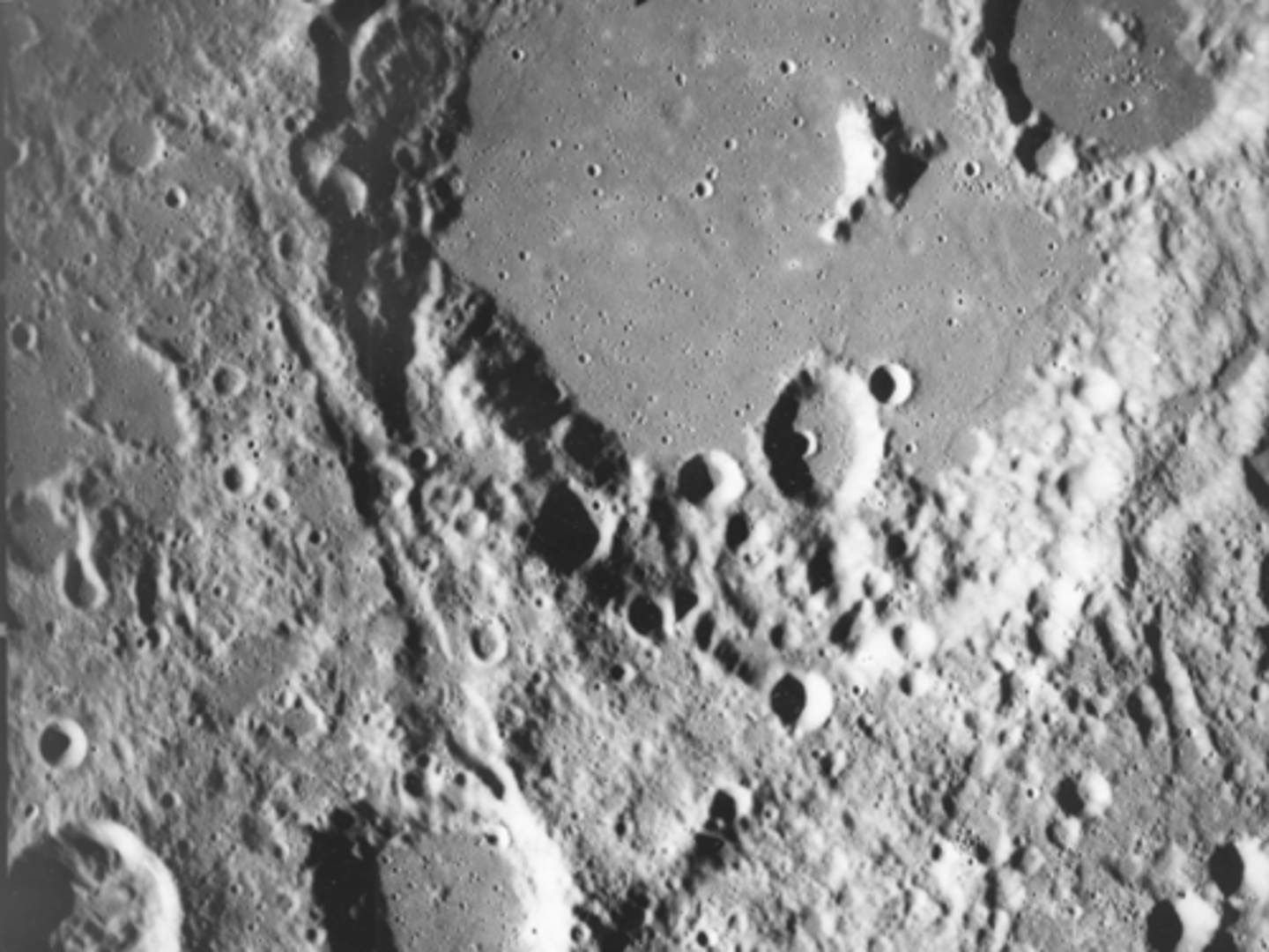 <p>What is the age of crater marked by yellow arrows compared to the others in the image?</p><p>What is the feature indicated by the red arrow?</p>