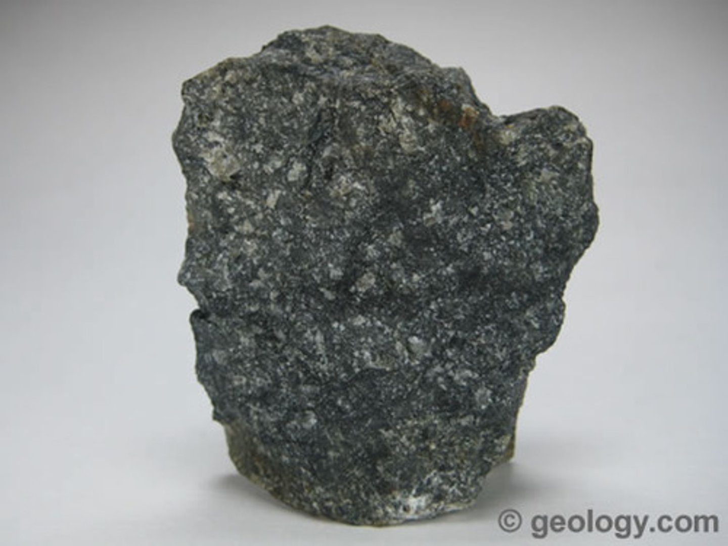 <p>F,I,M,UM: Ultra-mafic<br>Texture: Coarse-grained<br>Mineral composition: olivine, pyroxene<br>Other properties: dark green to black color.<br>Inferred rock origin: Intrusive. The coarse-grained version of komatiite.</p>