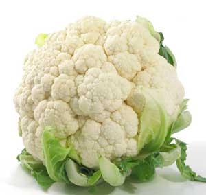 one large bulb with smaller pieces. These pieces have short white stems and sprouts at the ends. A cauliflower head also has green leaves at the bottom.