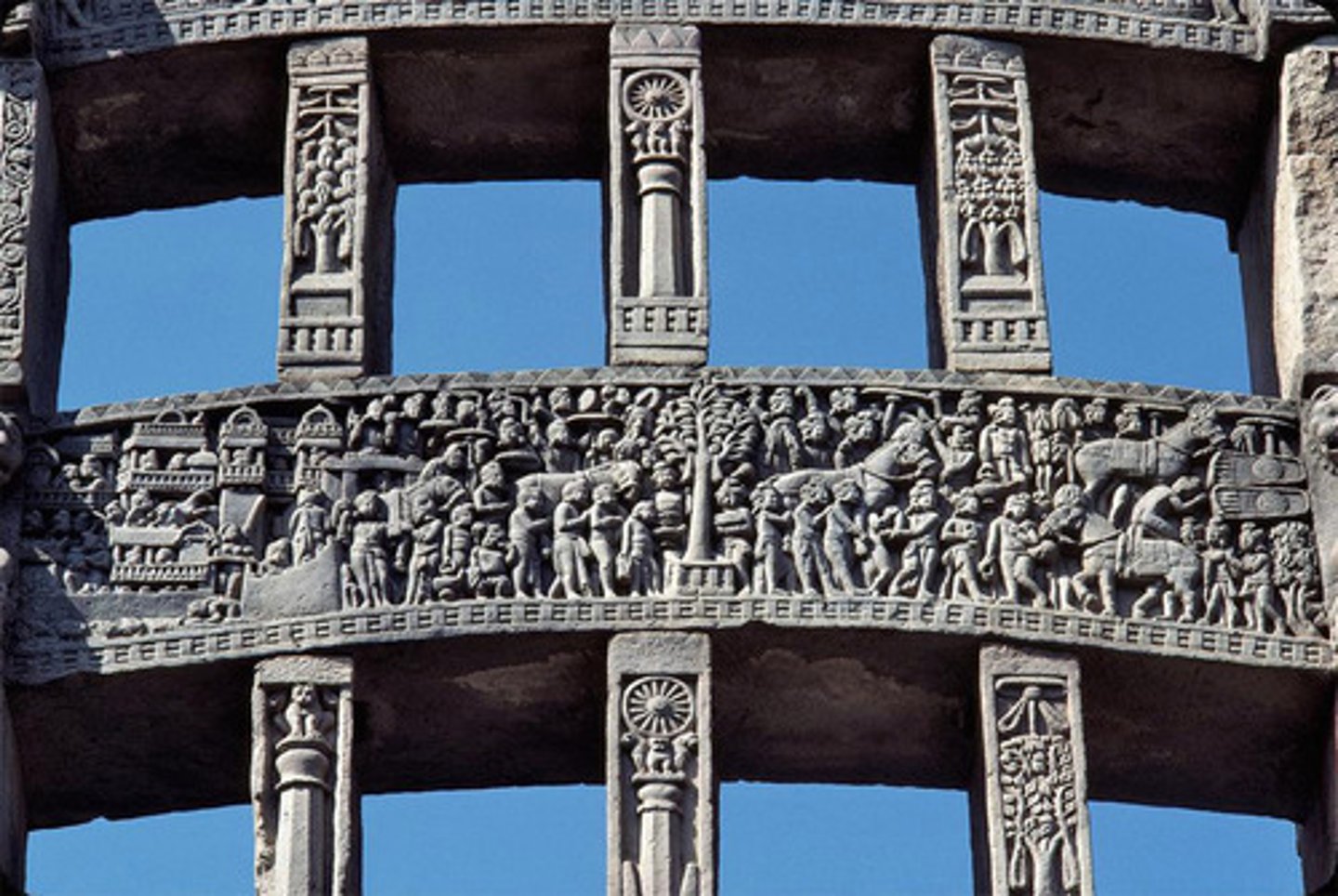 <p>gateway in the stone fence around a stupa, located at the cardinal points of the compass</p>