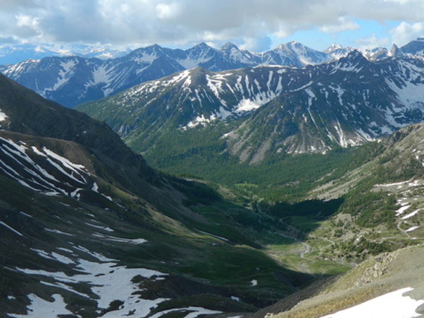 <p>an area of low land between hills or mountains</p>