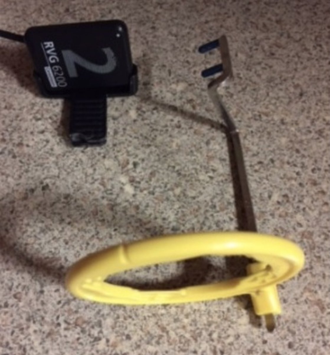 <p>1. The beam alignment device above will be used to take a posterior molar radiograph. What is the error?</p><p>2. What size is the standard size receptor?</p>