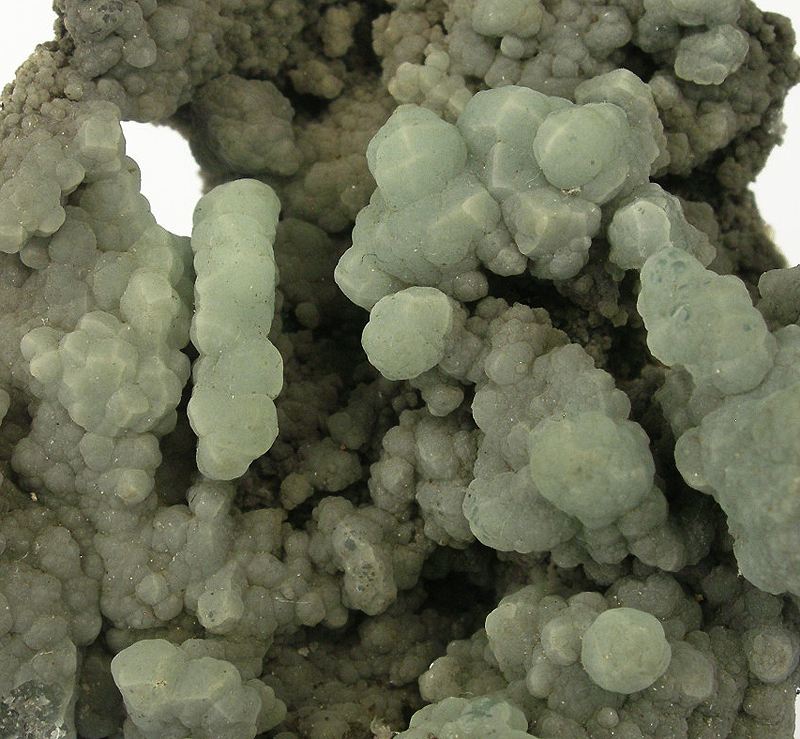 <p>Mineral habit that is characterized by a globular or rounded shape bunched together</p>