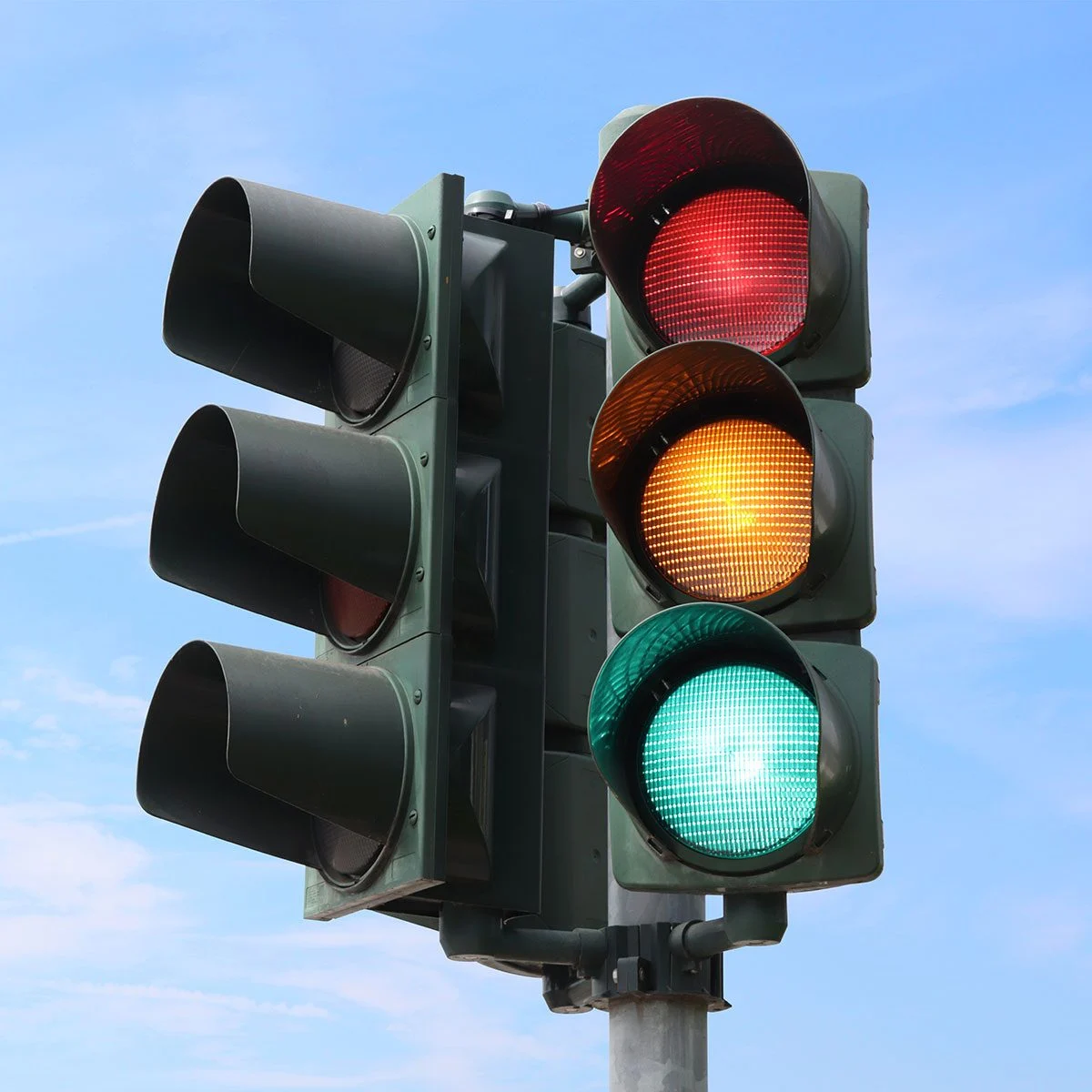 <p><strong>As you near an intersection, the traffic light changes from green to yellow. Your best action would be to..?</strong></p>