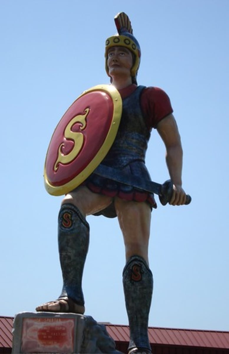 <p>a Greek city-state that focused on warfare; they were worried about the Helots (a group of people they conquered) overtaking them, so they trained the men to be great warriors. Sparta was the leader of the Peloponnesian League alliance.</p>