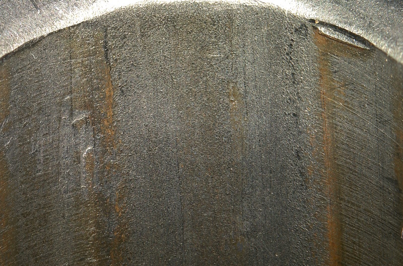 <p>What type of machining likely left this pock marked finish on the rifling of this barrel?</p>