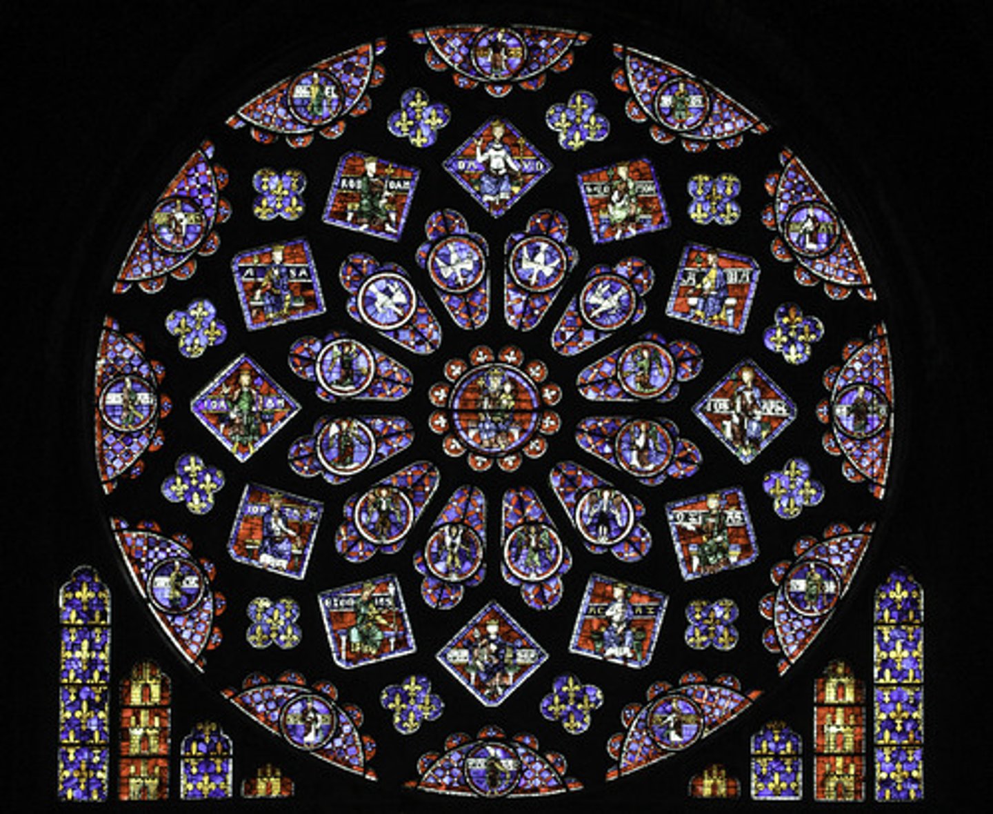 <p>a circular window with stained glass and stone tracery used on the facades and the ends of the transepts in Gothic cathedrals</p>