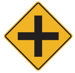 A road crosses the main highway ahead. Look to the left and right for other traffic. 