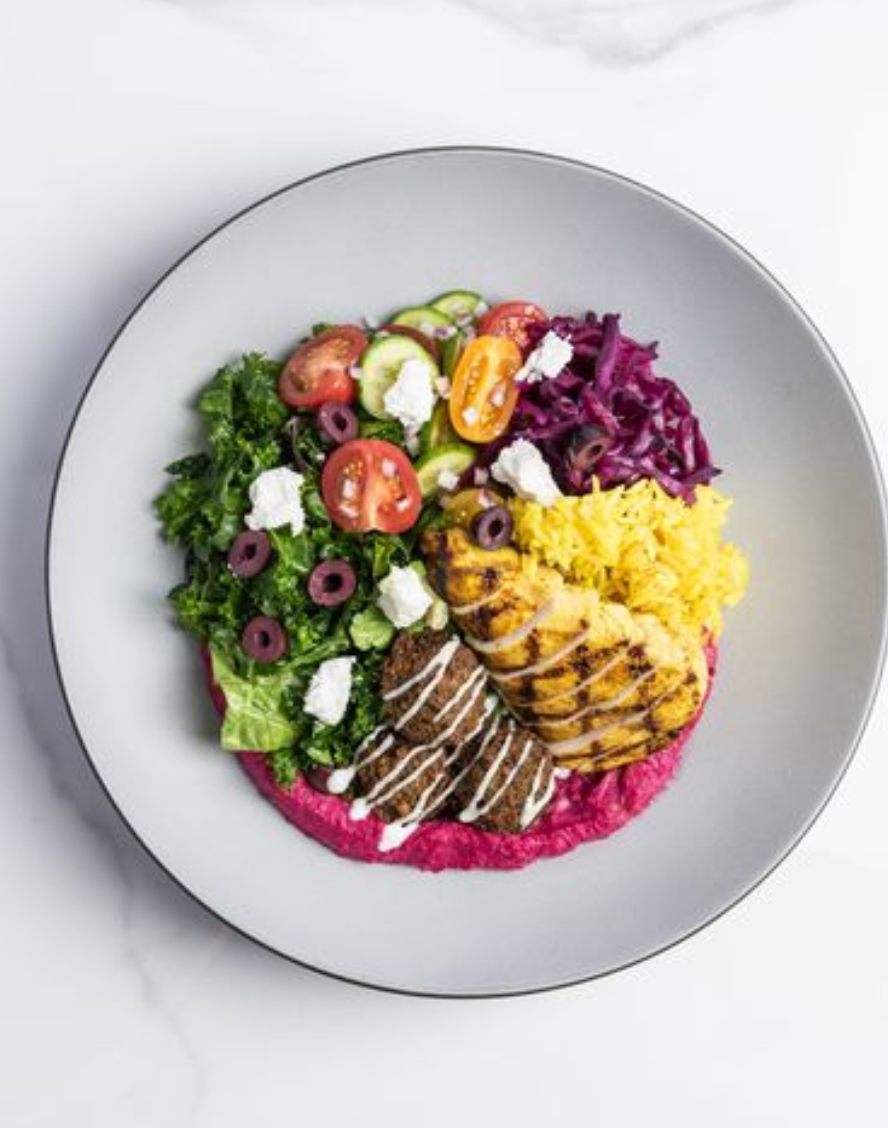 <p><span>turmeric rice, beetroot hummus, kale, cucumber, red onion, tomatoes, macedonian feta, kalamata olives, yogurt, pickled red cabbage, red wine vinaigrette. </span></p><p><span>3 falafels, or falafel and shawarma chicken for an extra charge. </span></p><p><span>Inspired by mediterranean cuisine. </span></p>
