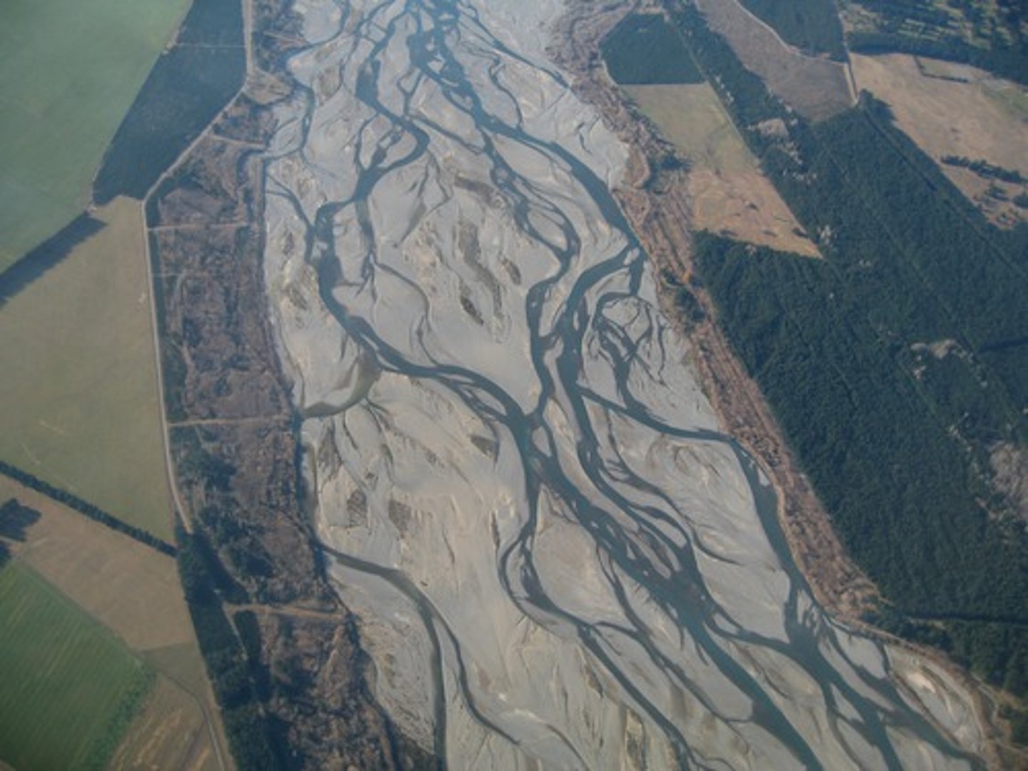 <p>A single channel flowing with many shallow interconnecting channels.</p>
