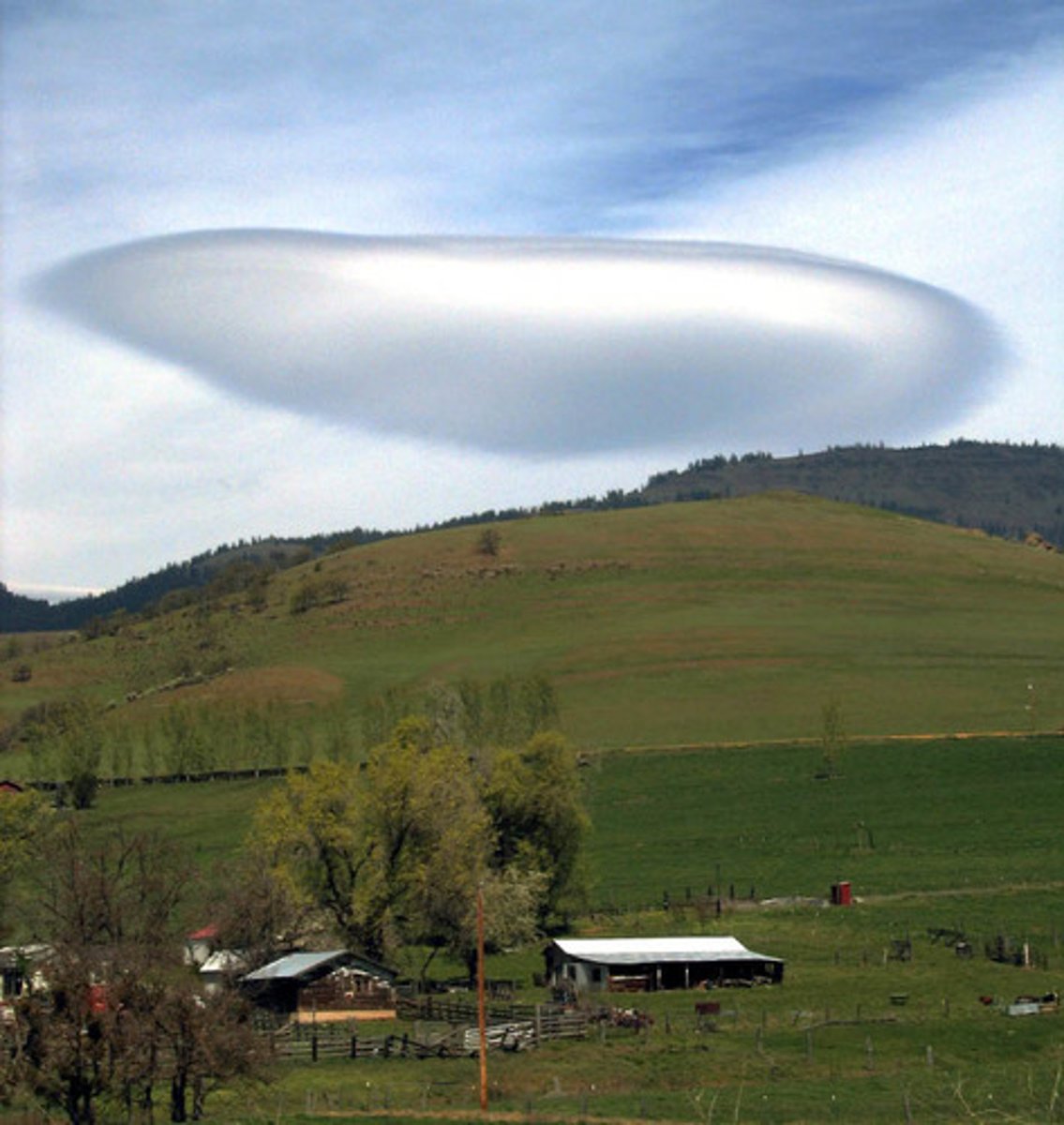 <p>caused by a wave wind pattern created by the mountains. They look like discs or flying saucers that form near mountains.</p>