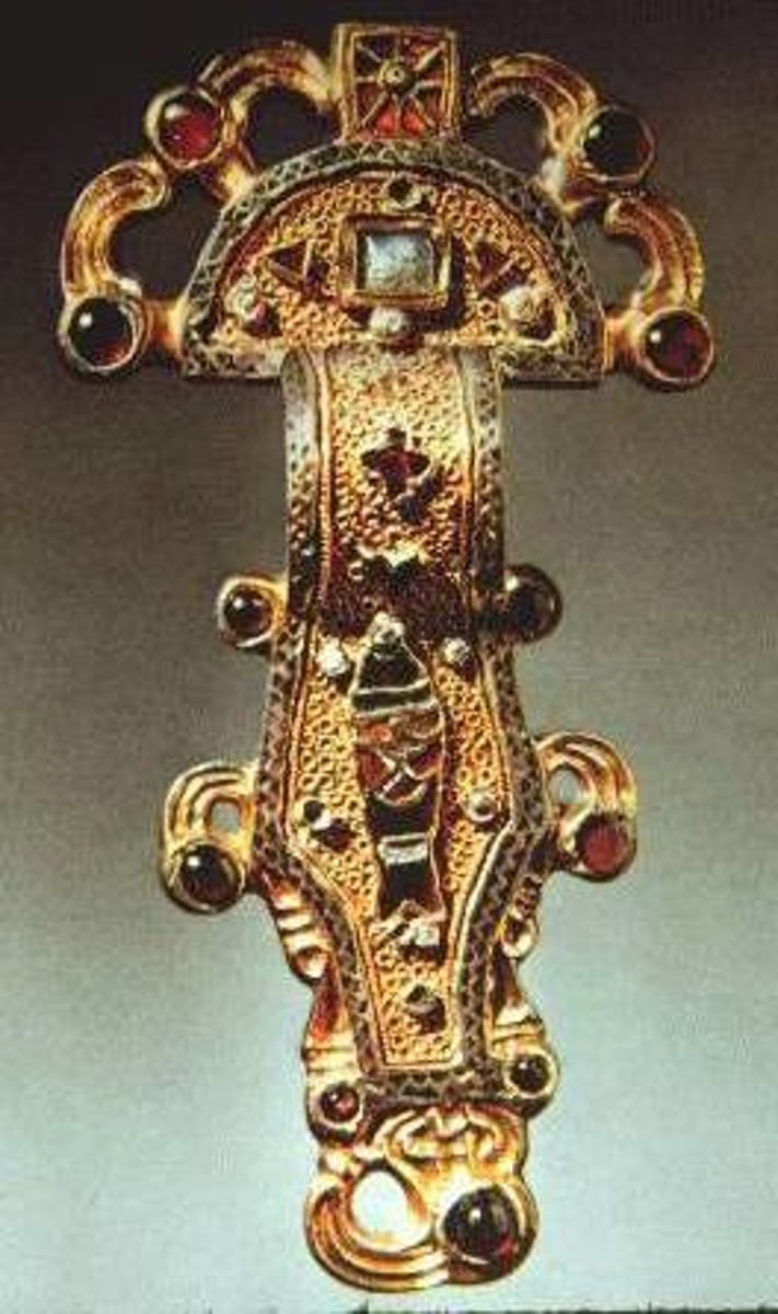 <p>A decorative brooch used to fasten garments, often elaborately crafted</p>