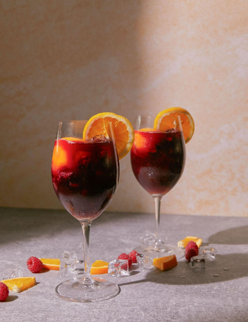 <p>Ingredients: <em>Zinfandel, apricot brandy, fresh strawberries &amp; raspberries, Sprite, and a splash of Bellini</em></p><p>Garnish: orange wheel, bellini slush. </p><p>Straw: tall</p>