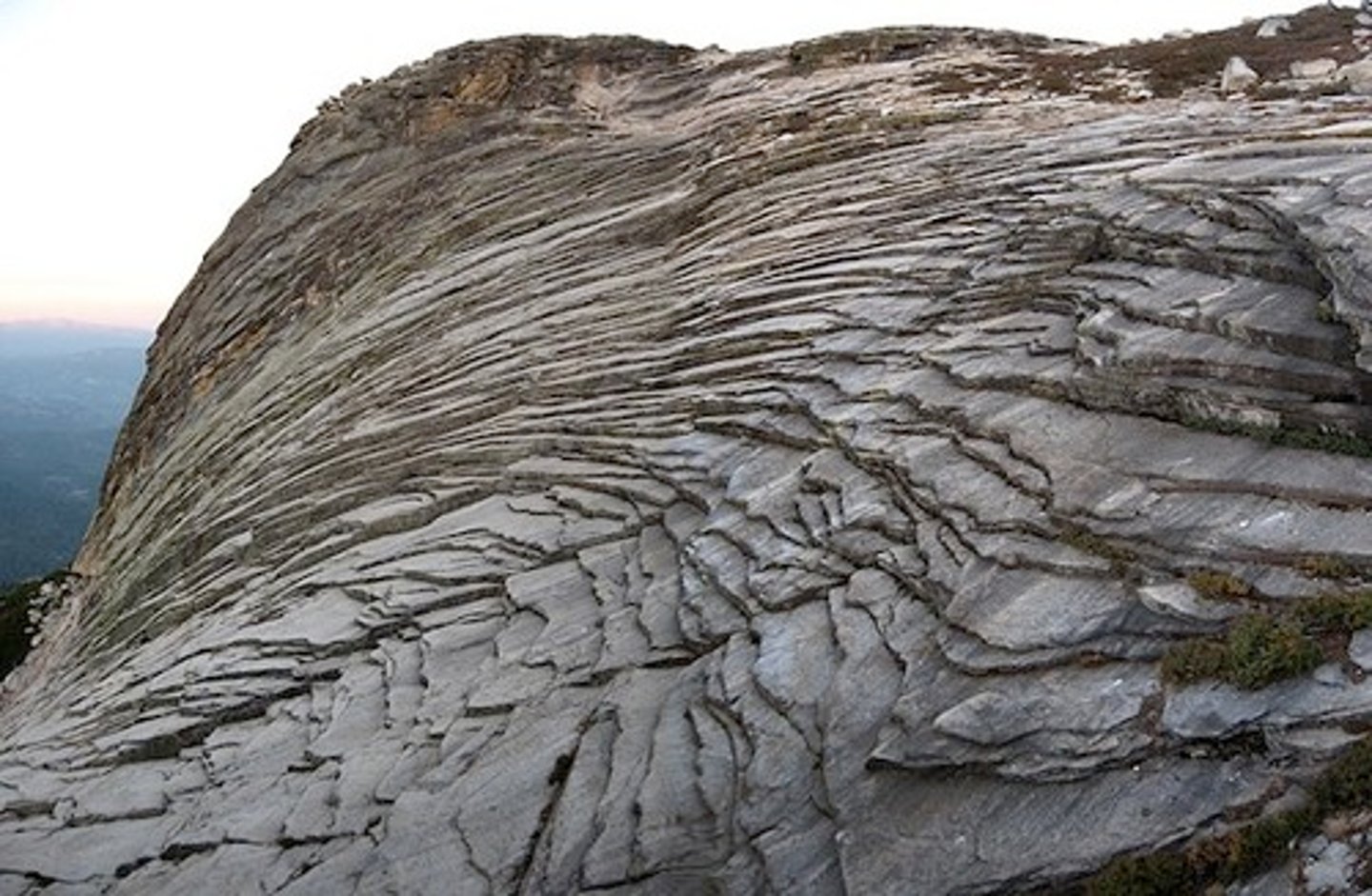 <p>sheets of rocks breaking off due to release of pressure (mechanical weathering)</p>