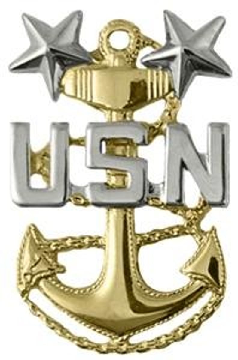 <p>Master Chief Petty Officer (MCPO)</p><p>Gold anchor with USN and two silver stars</p>