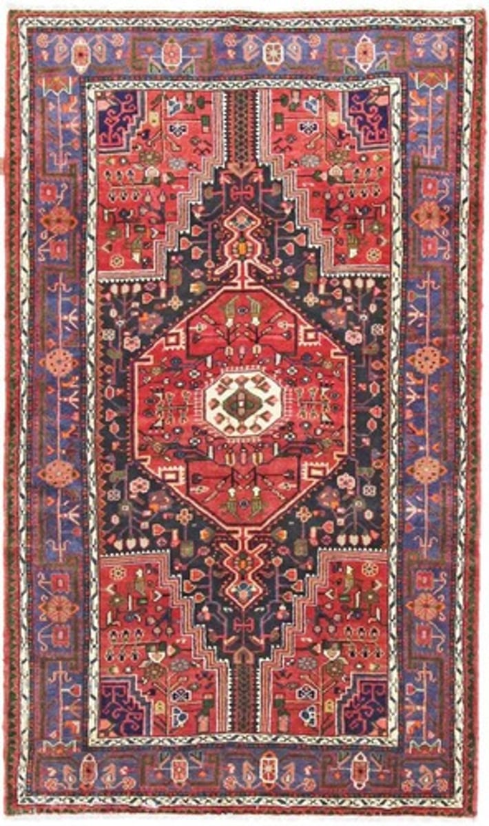 <p>Camel's hair rug with a coarse weave in light brown, reds and blues.</p>