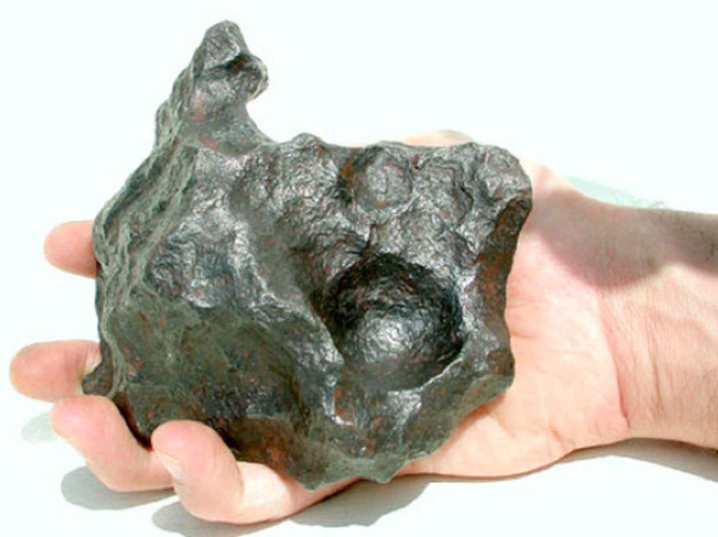 <p>A piece of space rock that passes through the atmosphere and strikes Earth's surface.</p>