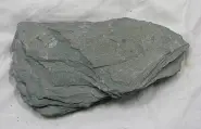 <p>This rock is dark gray in color, of low grade, and shows foliation. It is formed in regional metamorphism, and looks similar to its parent rock, shale.</p>