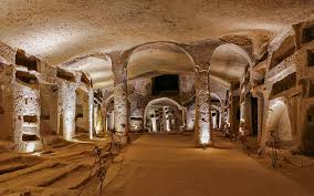 <p>Rome, 3rd-4th c.</p><p>EARLY CHRISTIAN AND BYZANTINE ART</p><ul><li><p>Loculi—> “shelves” of Christian bodies were entombed (estimated 4 million bodies entombed)</p></li><li><p>Orant figure—> prayerful pose (Christ, crucifixion, Christ in the temple)</p></li><li><p>Good Shepherd—> figure of Christ, New Testament book of John</p></li></ul><p></p>