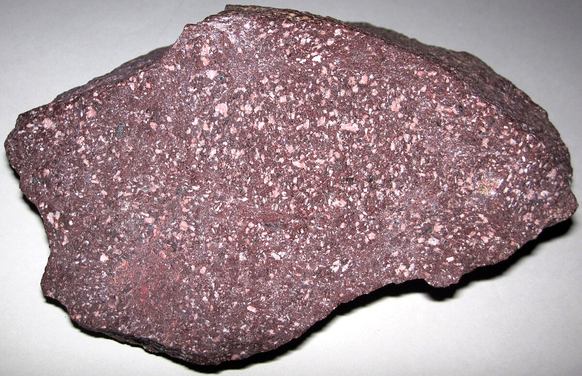 <p>Texture of igneous rocks with very large crystals embedded in smaller crystals</p>