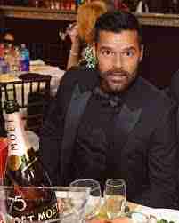 <p>Ricky Martin drinking rum(rum)</p>