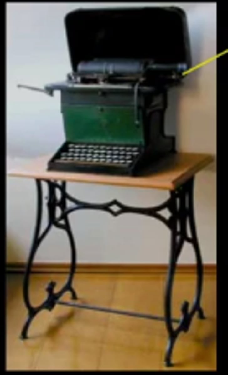 <p>Rasmus Malling Hansen, Writing Ball, 1870;</p><p>for braille, uses ball</p><p>Sholes and Glidden, Remington Type Writer, 1874</p><p>QWERY, but uses typebasket, gets jammed</p><p>(platen, foot treadle, typebasket, QWERTY keyboard)}</p>