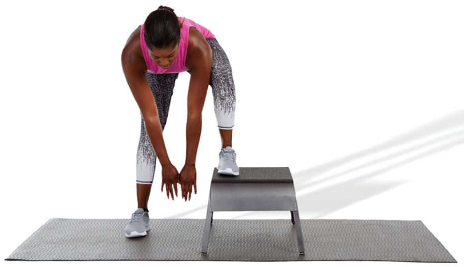 while standing with one foot on a bench or plyo box, reach down to a comfortable position without excessively rounding the spine until a stretch is felt