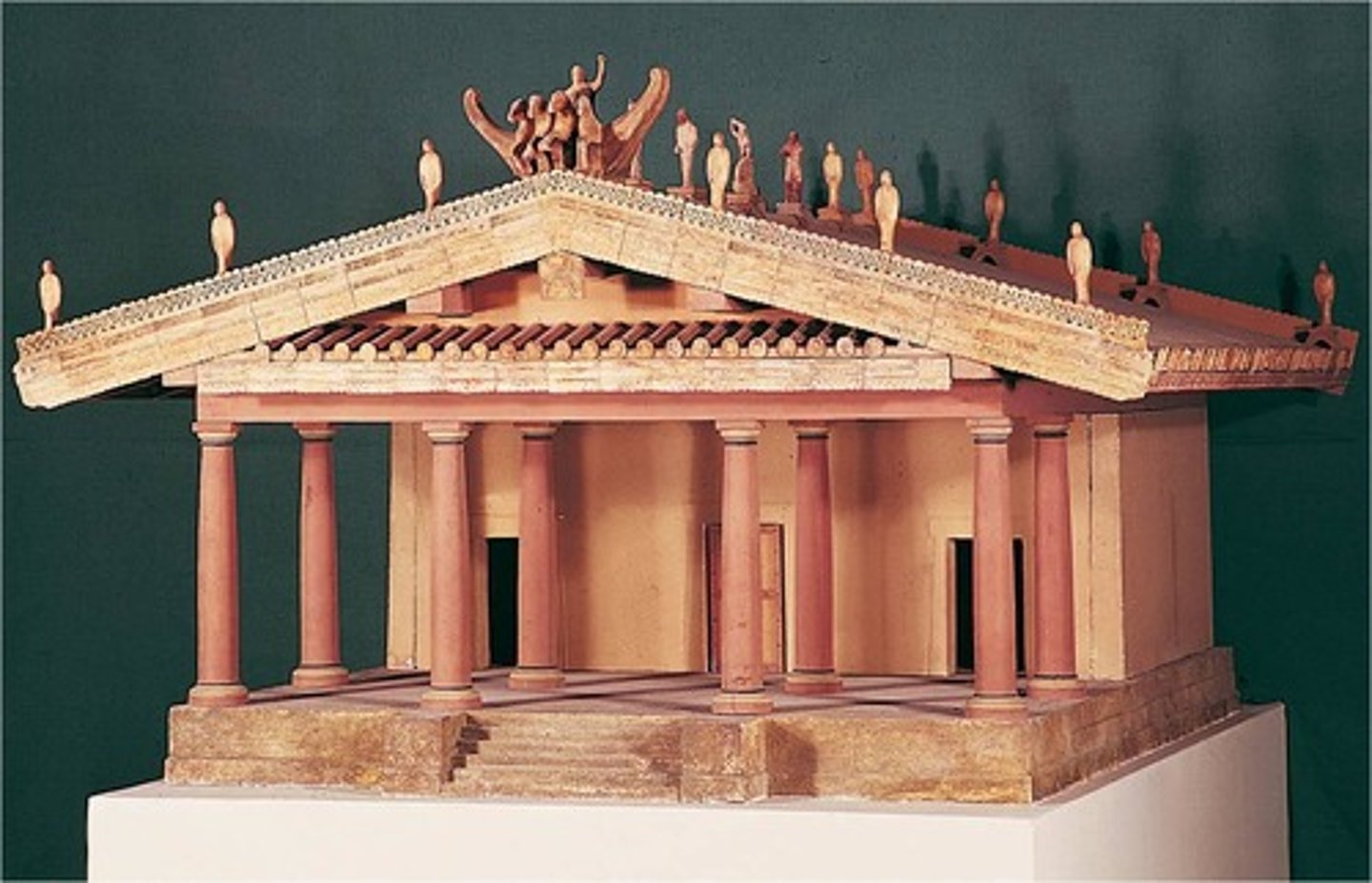 <p>- Rectangular stone structures built to house the statue of a deity</p><p>- Featured colonnades of columns in Doric, Ionic, or Corinthian orders</p><p>- The interior (cella/naos) held the cult statue; worship occurred outside</p><p>- Decorated with sculpted friezes, pediments, and painted metopes</p><p>- Examples include the Parthenon (Athens) and the Temple of Zeus (Olympia)</p>