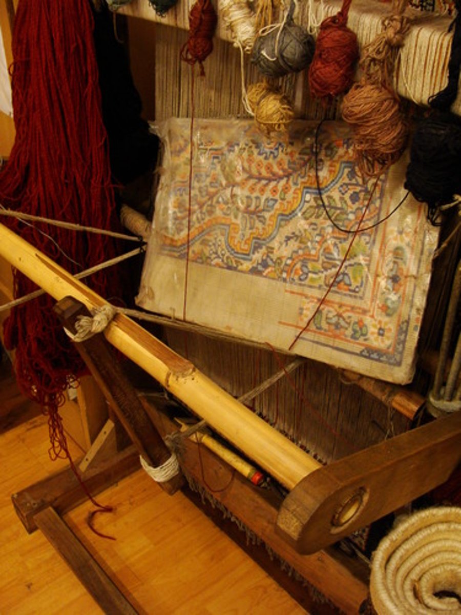 <p>in weaving, a thread that travels horizontally through the vertical warp in weaving; older term "woof"</p>