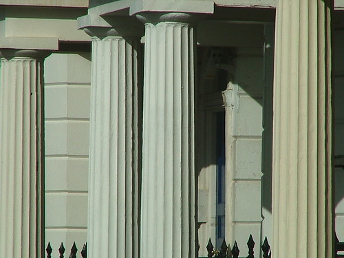 <p>an upright pillar, typically cylindrical and made of stone or concrete,</p>