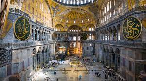 <ol><li><p>Built by Justinian to assert his imperial power after Nika riots</p></li><li><p>Built incredibly quickly and with disregard to expense</p></li><li><p>domed basilica was an incredible feat of architecture- built by Anthemius and Isidore</p></li><li><p>eventually becomes Islamic</p></li></ol>