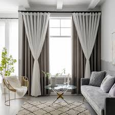 <p>curtains that hang behind the main curtains </p>