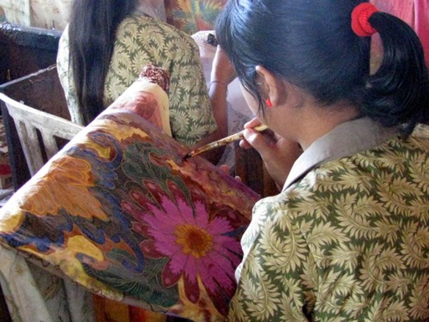<p>method of dyeing fabric by covering certain sections with wax</p>