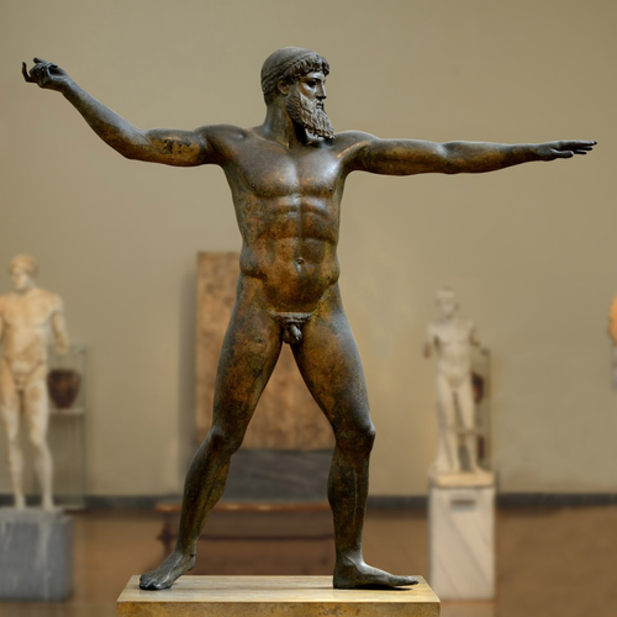 <p>describe the composition of the Zeus sculpture and its significance</p>