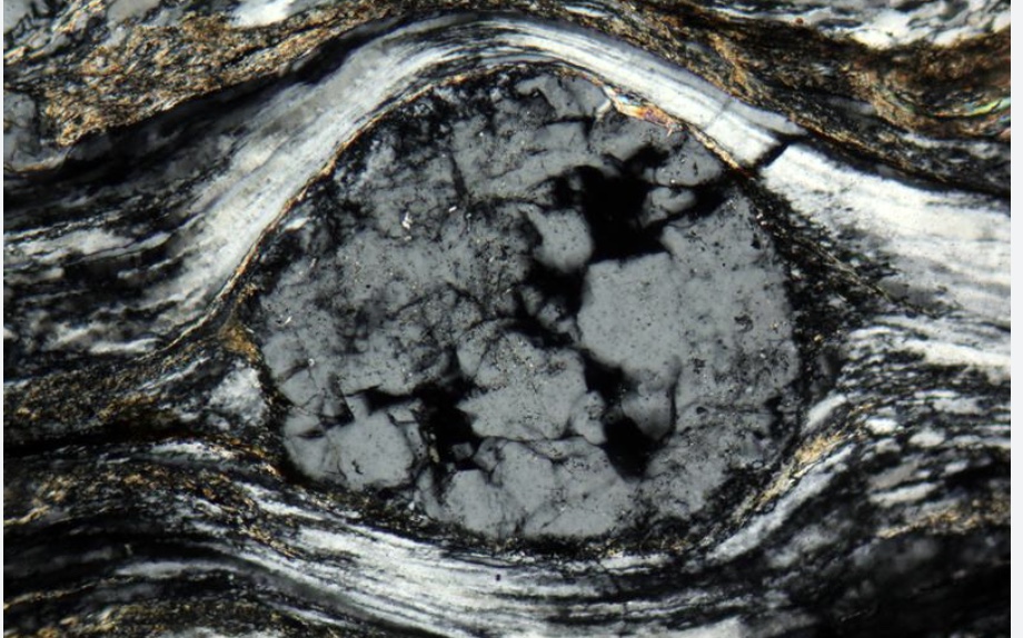 <p><mark data-color="#fffefe" style="background-color: #fffefe; color: inherit">a mineral fragment or relict grain within a metamorphic rock that is larger than the surrounding, finer-grained matrix</mark></p>