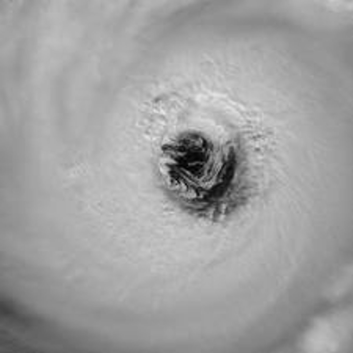 <p>Area of lowest atmospheric pressure in the tropical cyclone. Appears eerily calm.</p>