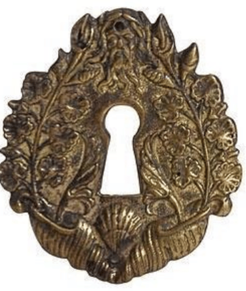 <p>A decorative metal plate that is placed against a door or drawer face behind the pull</p>