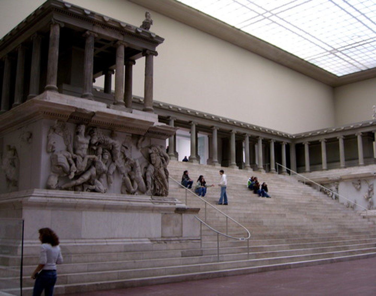 <p>Form:<br>-marble frieze<br>-elevated with steep dramatic staircase<br>-complex forms with big muscles showing violent energy and detail<br>-ionic columns<br>Content:<br>-frieze wrapping around the monument shows gods overpowering the Titans<br>-Titans vs. Olympians<br>-"Athena": gigantomachy, battle between the gods and giants (gods win)<br>Function:<br>-war monument (Greek defeat of Gauls)<br>-break architectural boundaries <br>-altar dedicated to ZeusContext:<br>-175 BCE<br>- Asia Minor, Turkey</p>