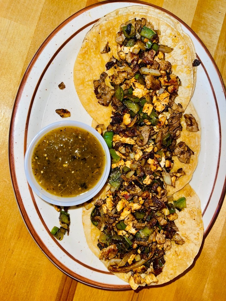 <p>Three tortillas topped with skirt steak, al pastor, grilled chicken, bell peppers, and onion. Comes with rice, refried beans, and habanero sauce.</p>