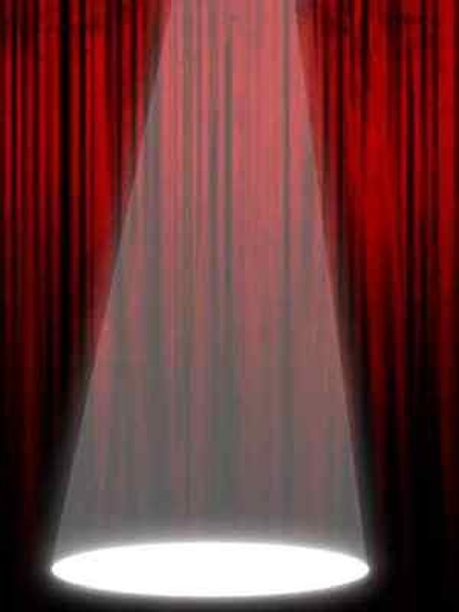 <p>a small circle of light around one part of the stage</p>