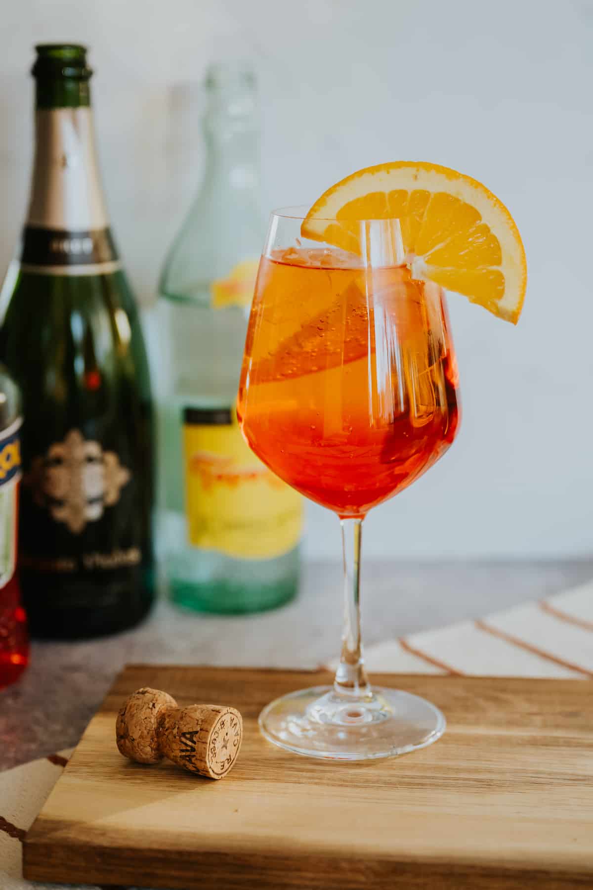 <p>sparkling, 2 oz aperol, 3 oz prosecco, splash soda water, served in a wine glass on the rocks, garnished with orange</p>