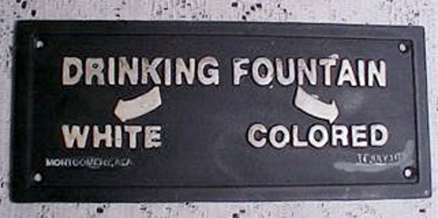 <p>the separation of individuals based on their characteristics, such as race, intentionally and by law</p>