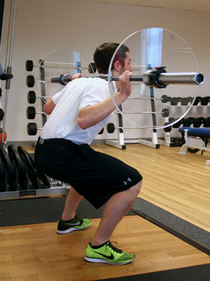 <p><span><span>The posterior pelvic tilt seen in this picture, is commonly seen in bilateral leg exercises a result of tight ____________________.</span></span></p>