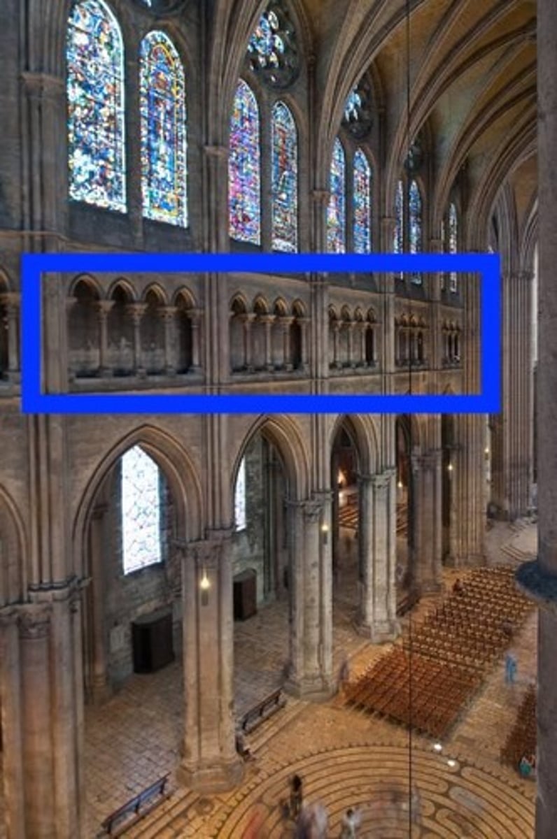 <p>a cloister or gallery, one side of which is formed by arcades.</p>