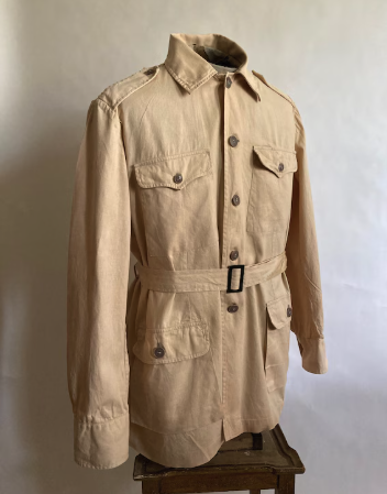 <p>short-sleeved tan cotton jackets with four large flapped pockets made to imitate styles worn by hunters and explorers in Africa</p>